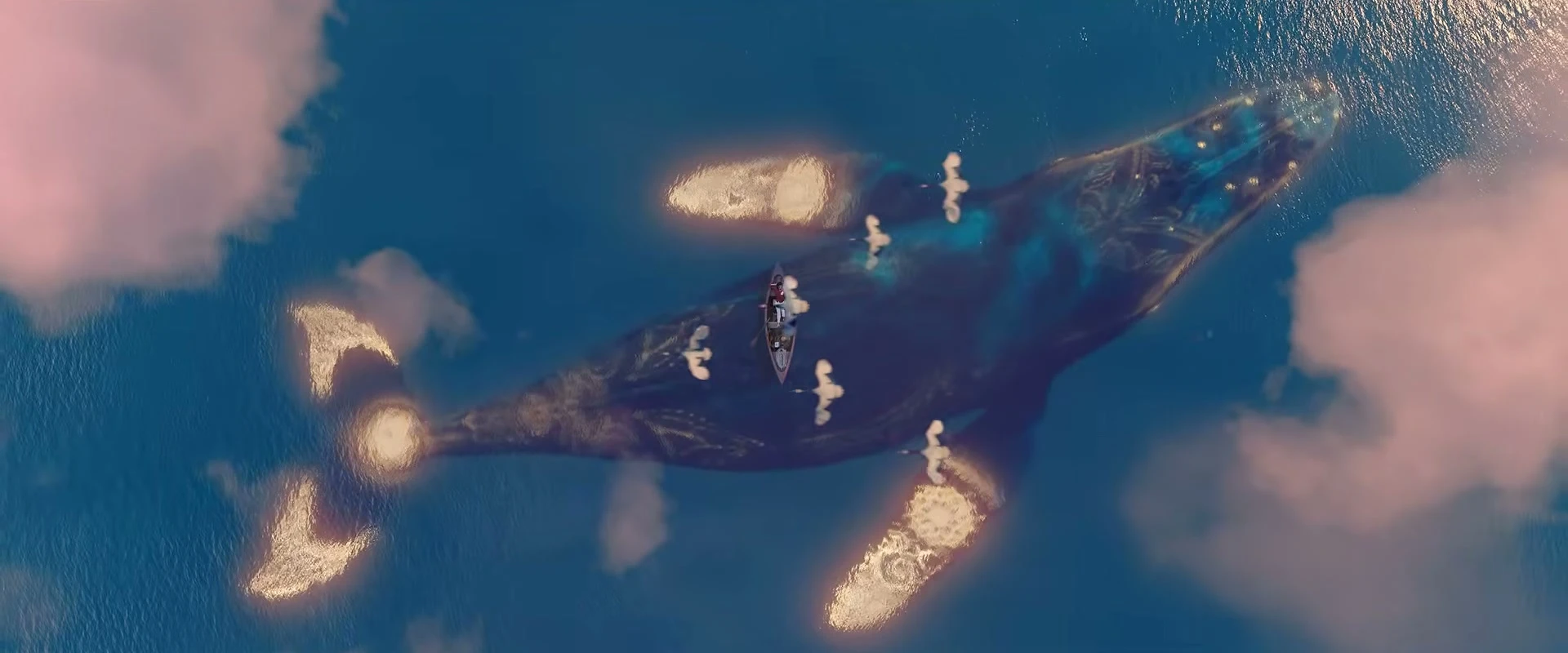An immense creature with golden markings beneath the ocean